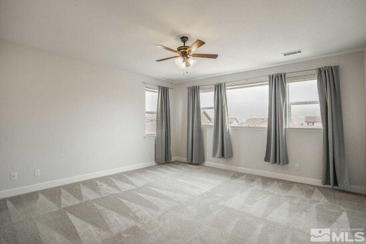 10370 Culiacan Pass Trail Reno, NV 89521 - Photo 17 of 25 a view of an empty room with a window