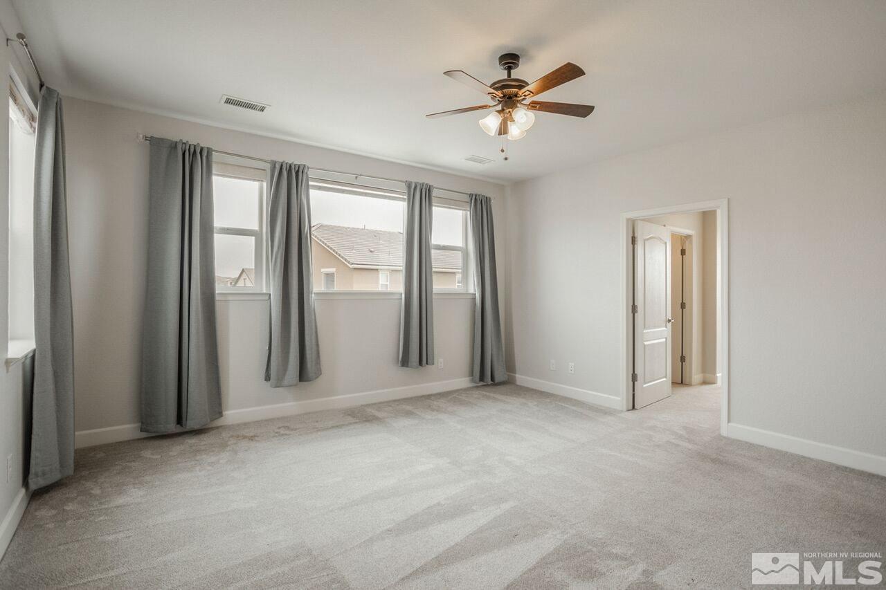 10370 Culiacan Pass Trail Reno, NV 89521 - Photo 18 of 25 a view of an empty room with a window