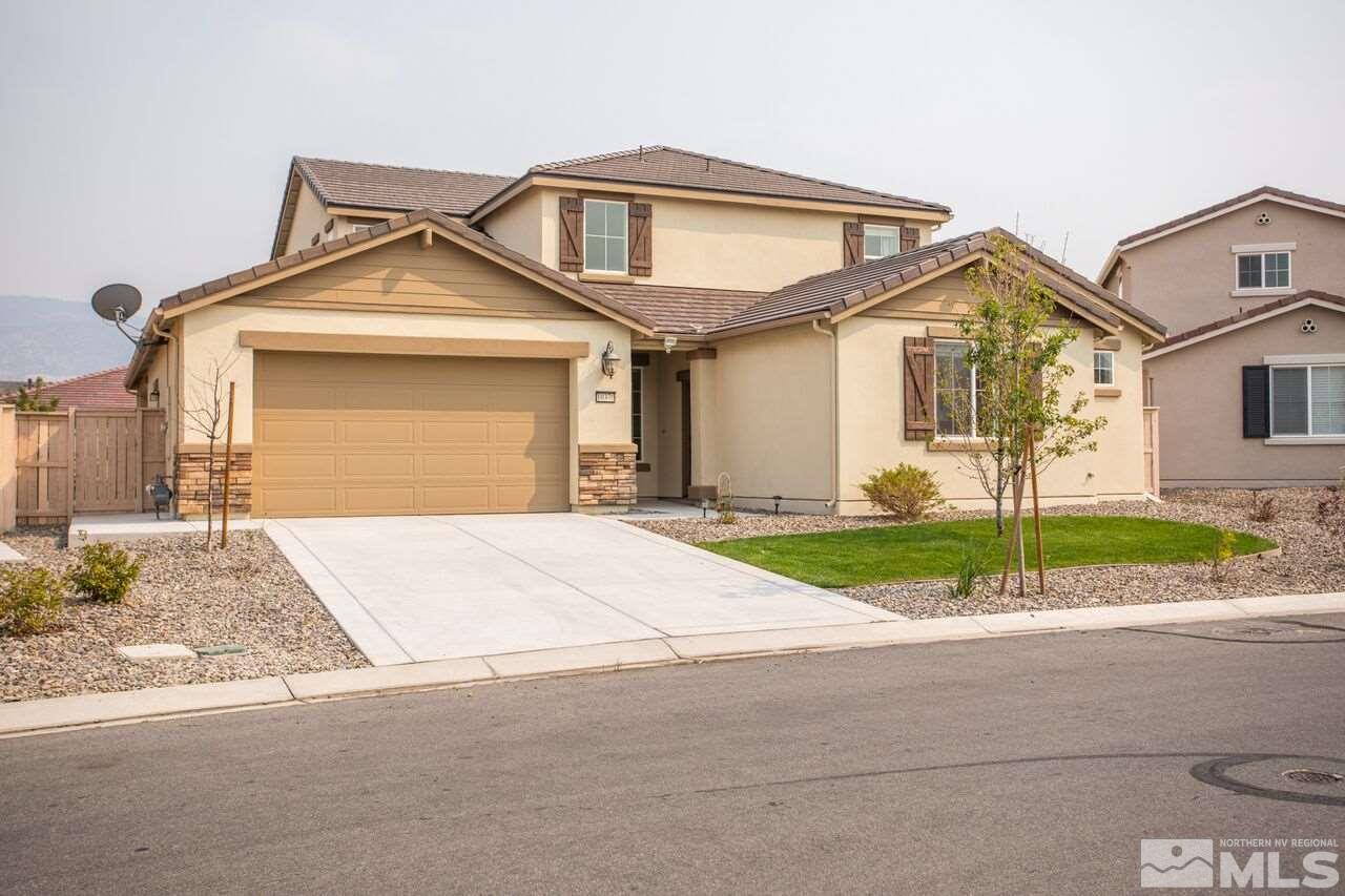10370 Culiacan Pass Trail Reno, NV 89521 - Photo 2 of 25 a front view of a house with a yard and garage