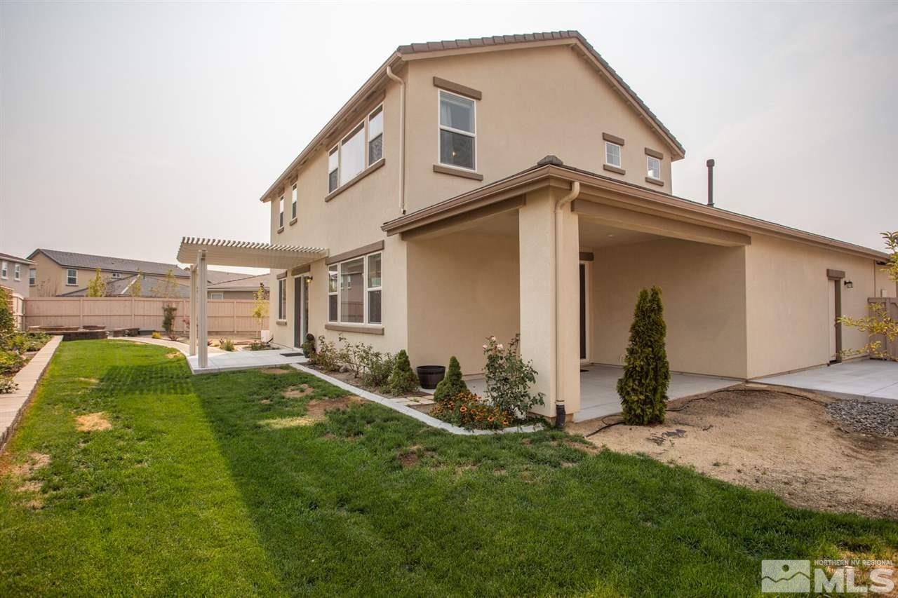 10370 Culiacan Pass Trail Reno, NV 89521 - Photo 24 of 25 a backyard of a house with table and chairs