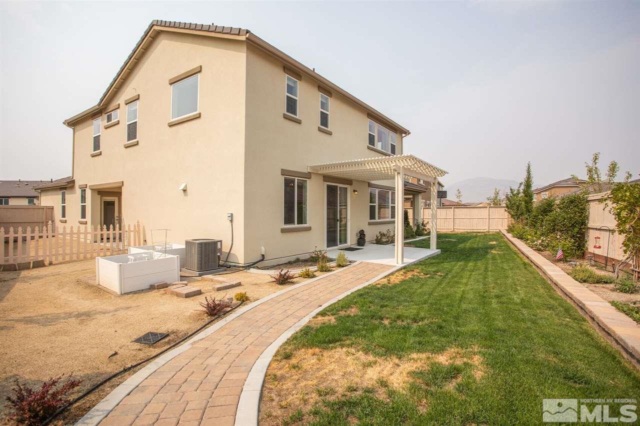 10370 Culiacan Pass Trail Reno, NV 89521 - Photo 25 of 25 a swimming pool with outdoor seating and yard
