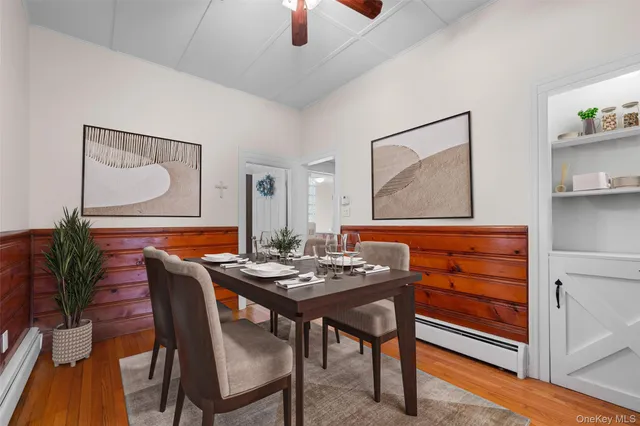 a dining room with furniture and window