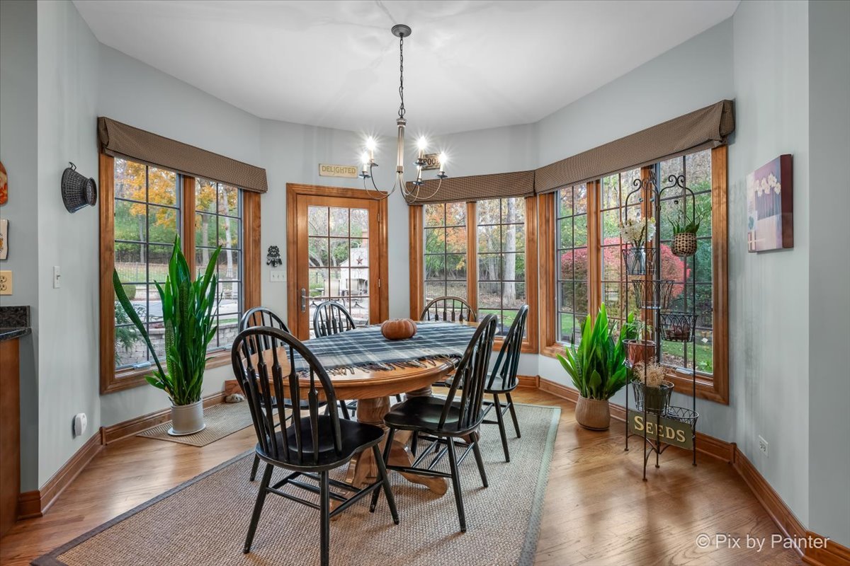 24881 North Black Walnut Cary, IL 60013 - Photo 19 of 53 a view of a dining room with furniture window and wooden floor