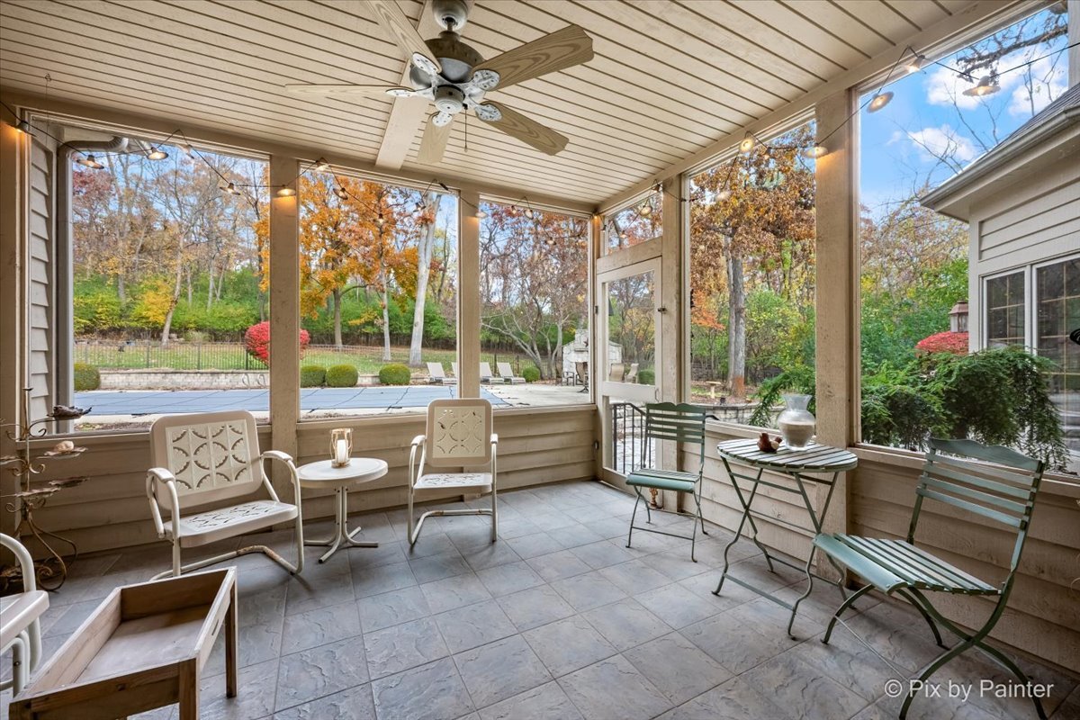 24881 North Black Walnut Cary, IL 60013 - Photo 26 of 53 a living room with patio furniture and a floor to ceiling window
