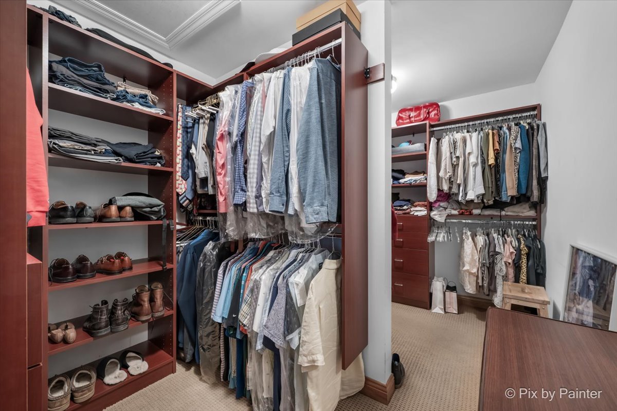 24881 North Black Walnut Cary, IL 60013 - Photo 32 of 53 a view of walk in closet with clothes and shoes