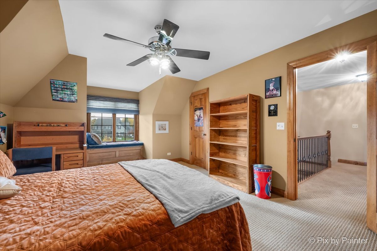 24881 North Black Walnut Cary, IL 60013 - Photo 34 of 53 a bedroom with a bed and a television