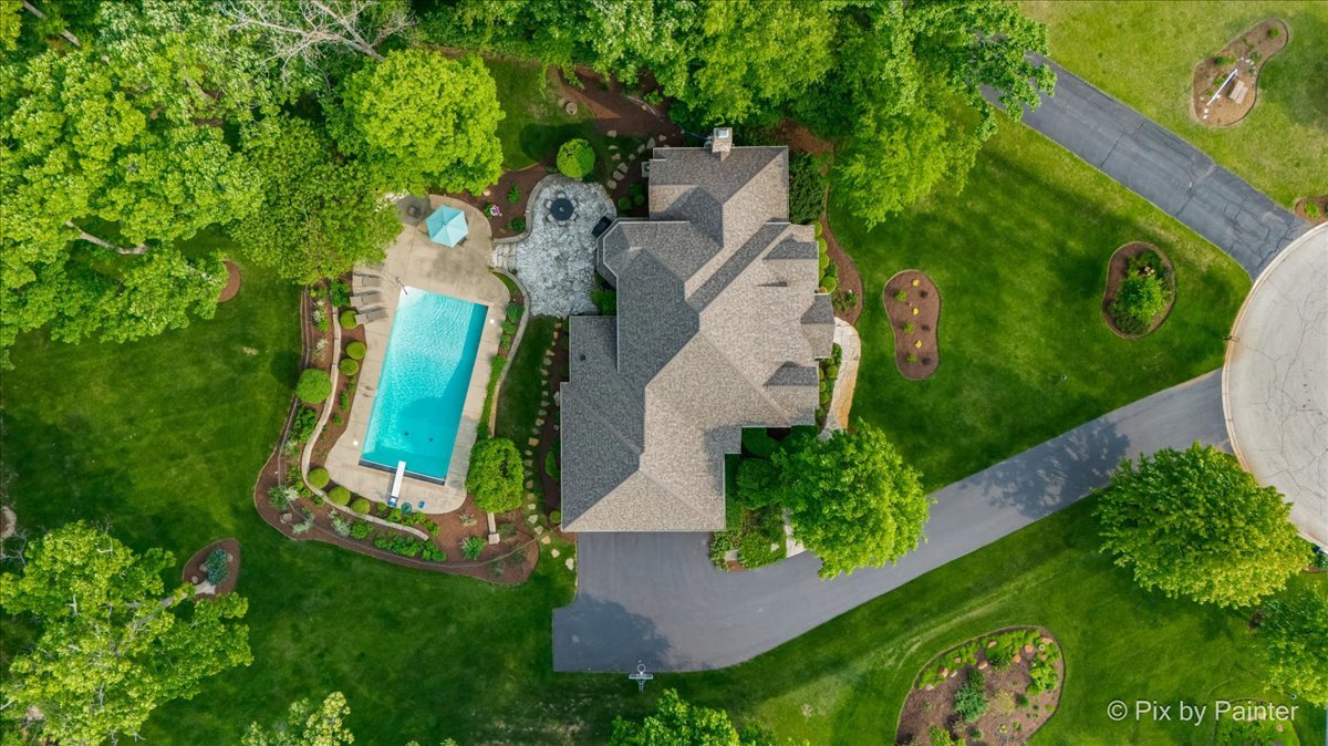 24881 North Black Walnut Cary, IL 60013 - Photo 42 of 53 an aerial view of a house with a garden and trees