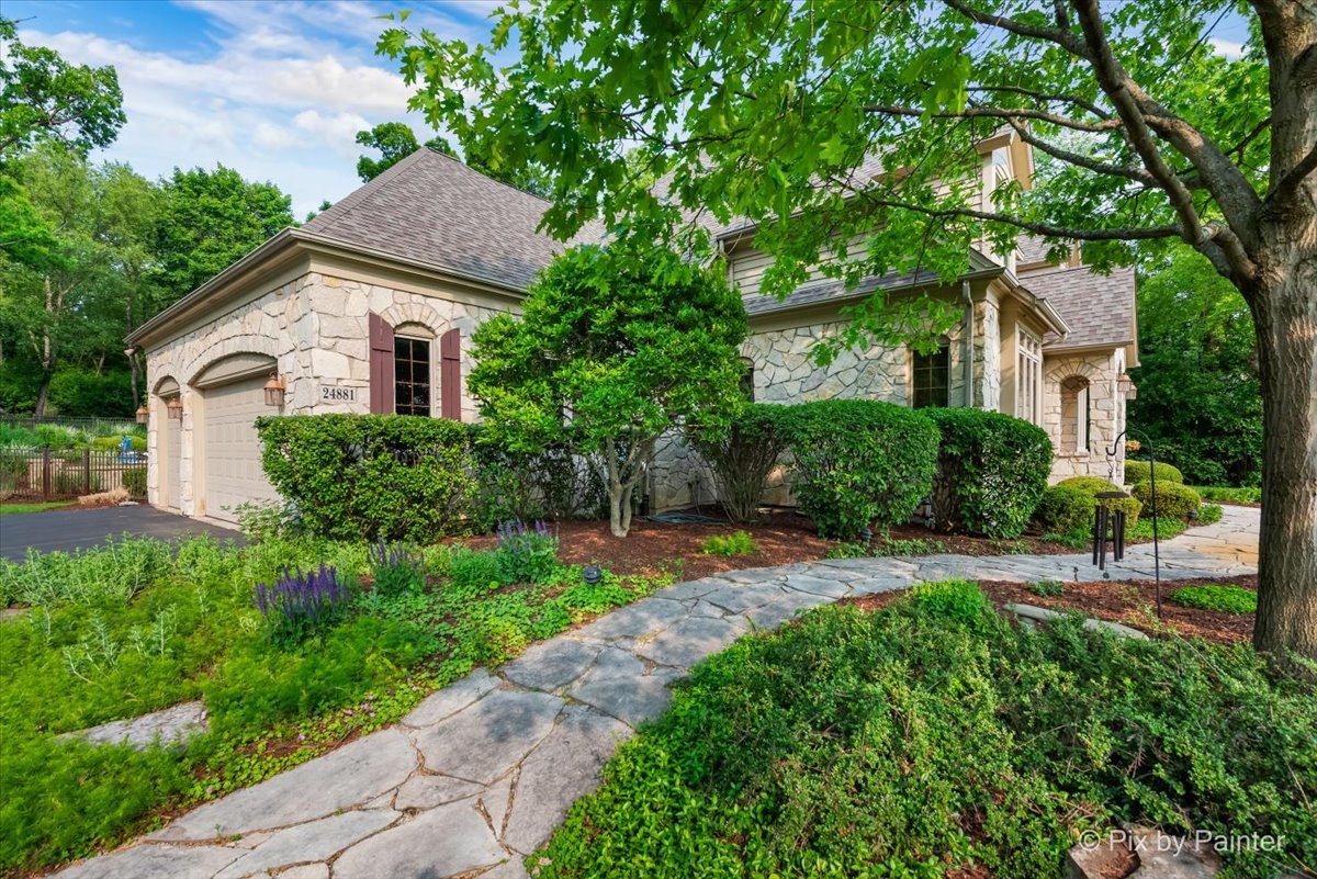 24881 North Black Walnut Cary, IL 60013 - Photo 47 of 53 a house that has a tree in front of it