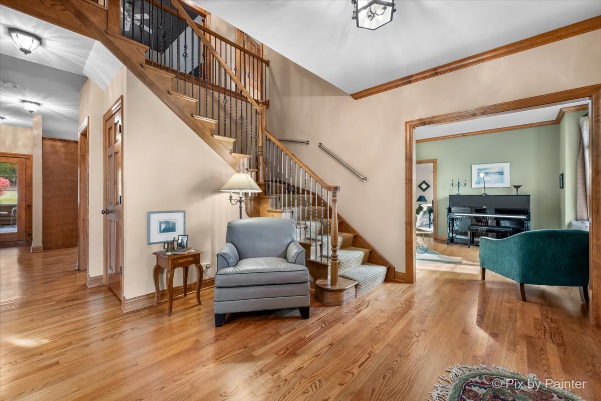 24881 North Black Walnut Cary, IL 60013 - Photo 8 of 53 a living room with furniture and a wooden floor