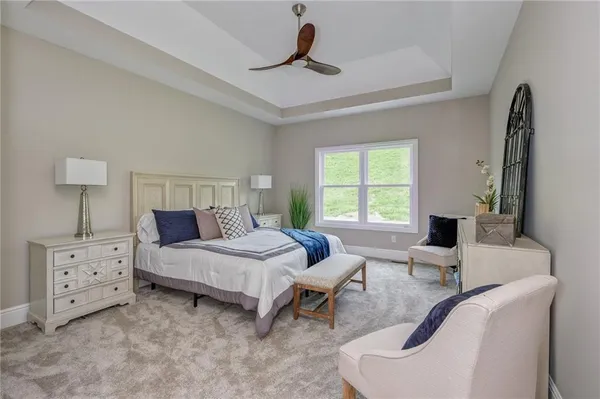 a bedroom with furniture and a window