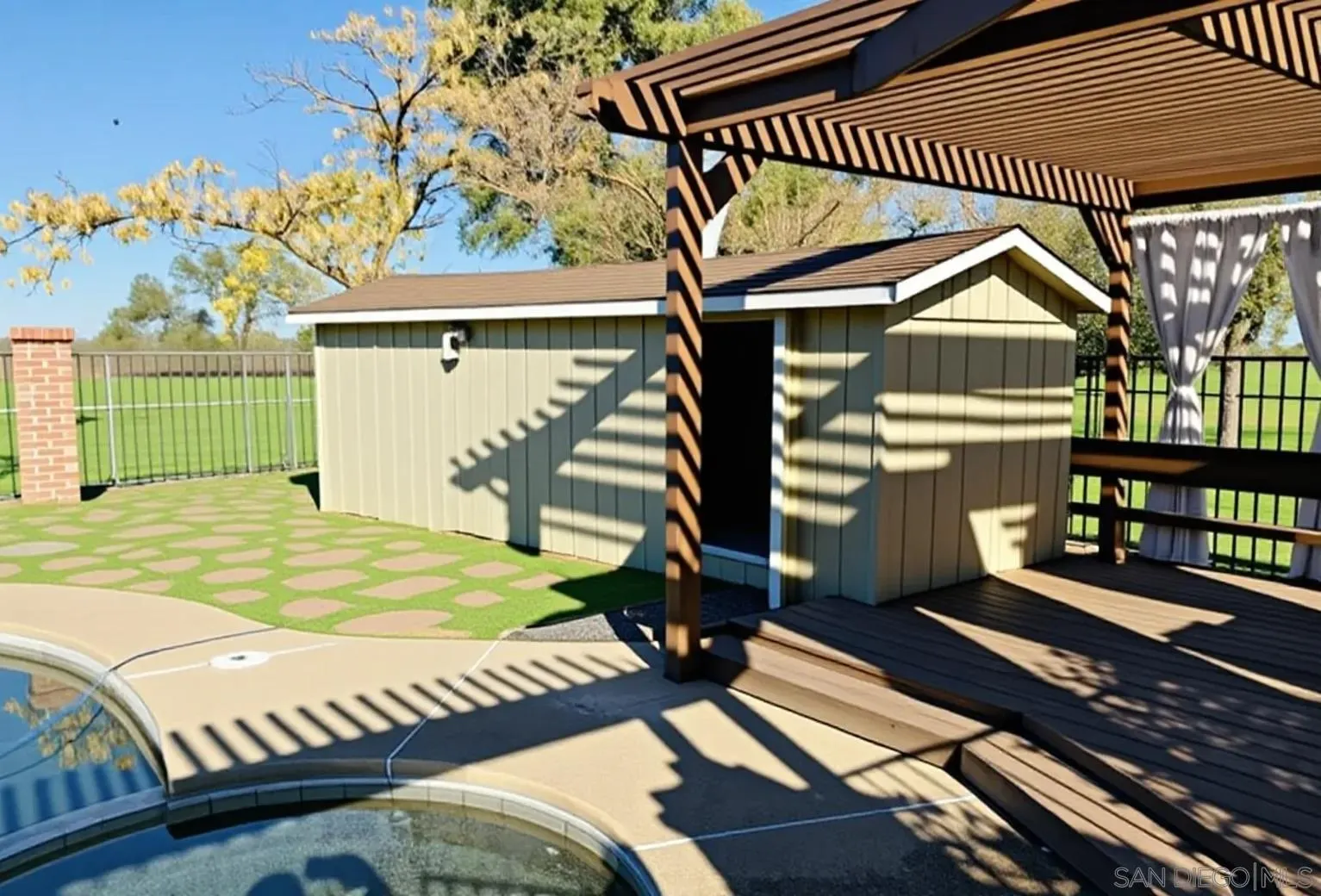 19901 Atkins Road Lodi, CA 95240 - Photo 6 of 27 a view of a house with a wooden deck