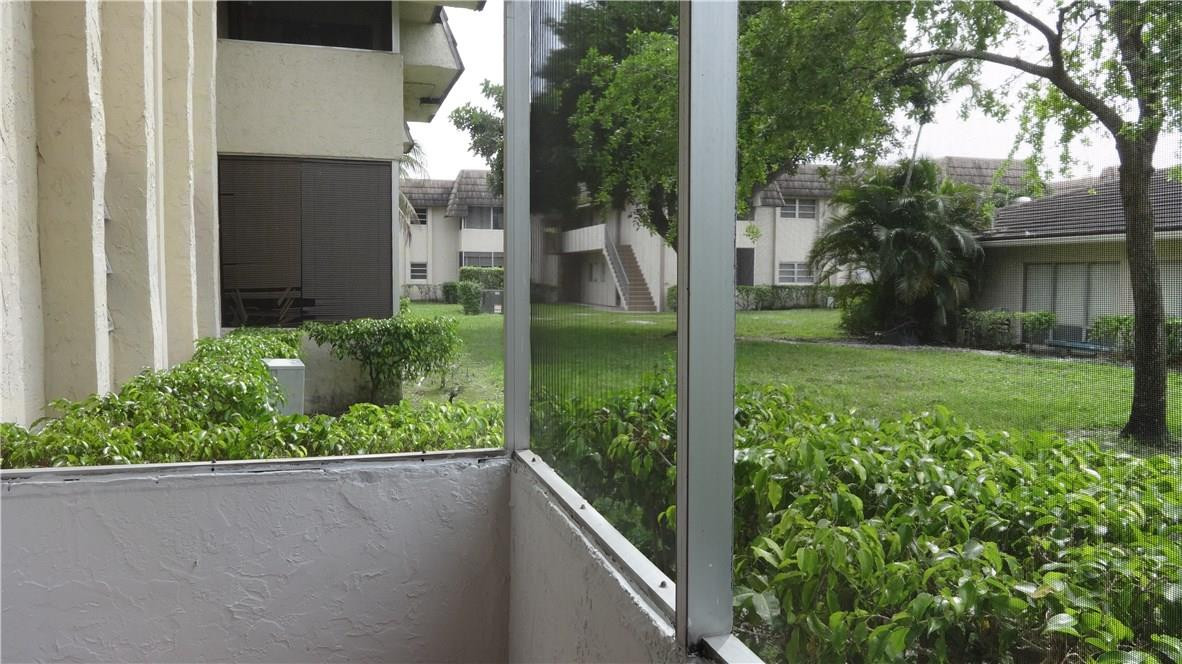 8402 West Sample Road, Unit 141 Coral Springs, FL 33065 - Photo 17 of 18 SCREENED PATIO