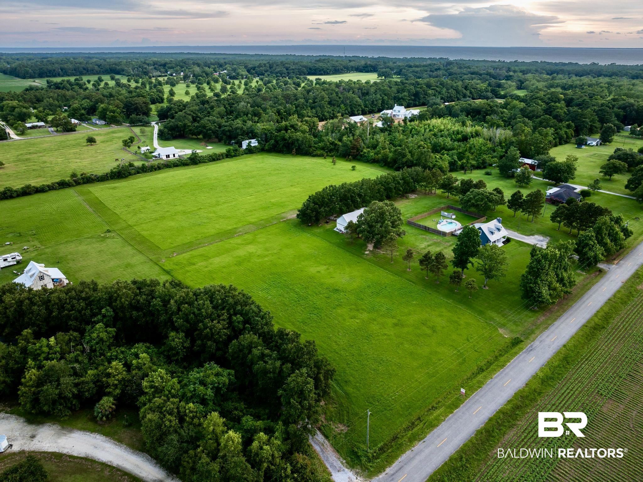 Aerial view at dusk featuring a rural view