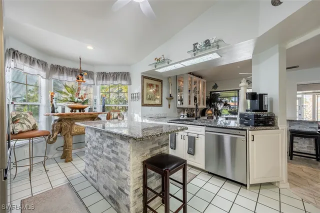 a living room with fireplace furniture and a chandelier