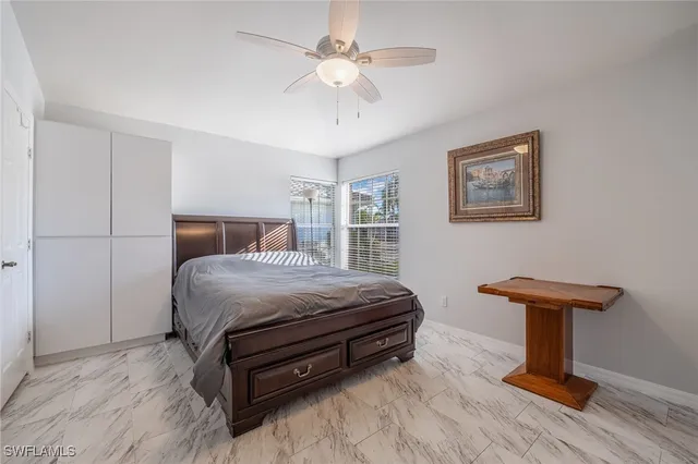 a bedroom with a bed and a tv