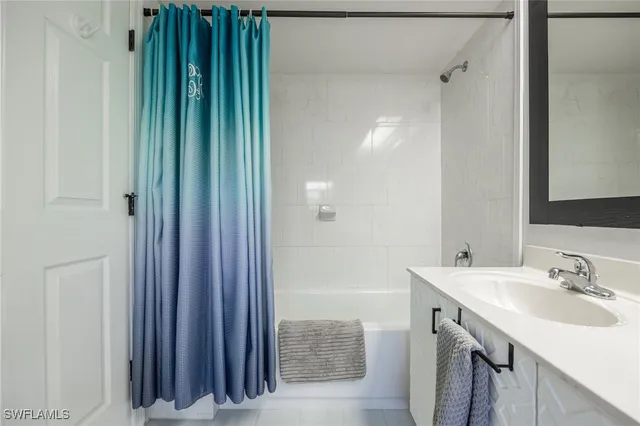 a bedroom with bed and window