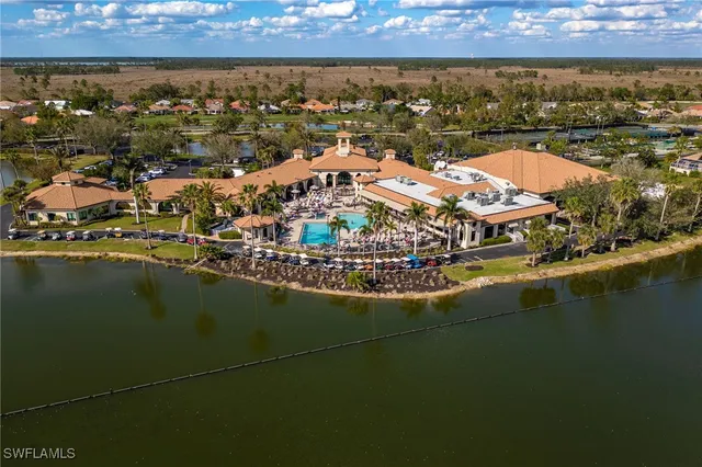 an aerial view of a residential houses with outdoor space