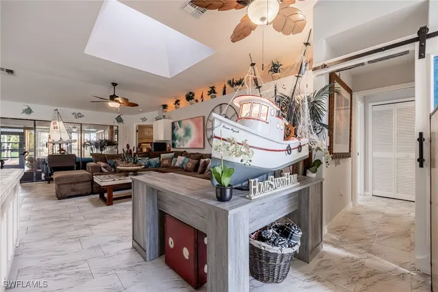 a view of livingroom with furniture and windows