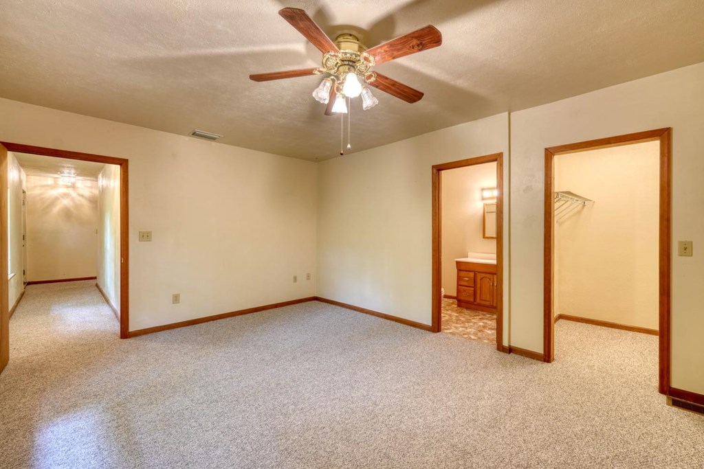 1066 Ridge Road Hiawassee, GA 30546 - Photo 30 of 51 an empty room with closet and a chandelier fan