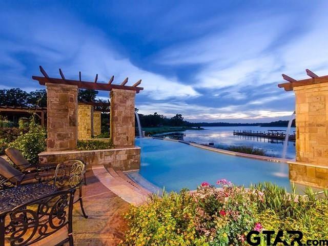 2831 J.Cupit Court Tyler, TX 75709 - Photo 5 of 6 a view of a patio with table and chairs and potted plants
