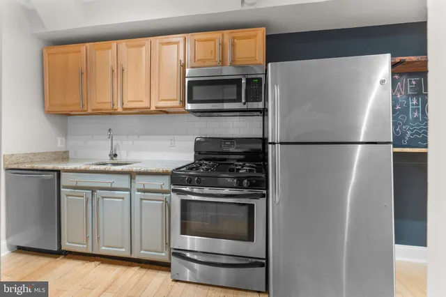 a white refrigerator freezer and a stove top oven