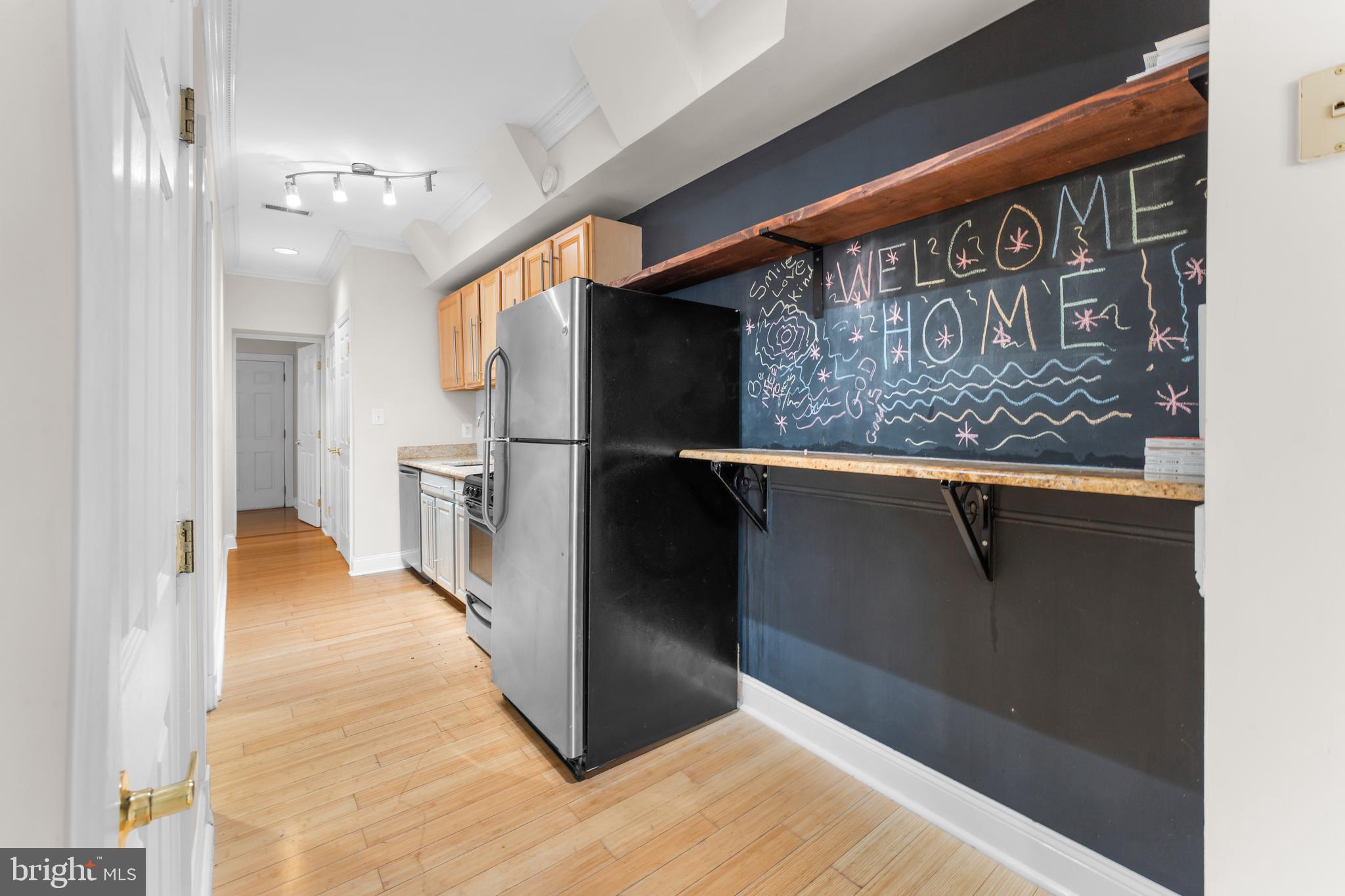 550 Hobart Place Northwest, Unit 1 Washington, DC 20001 - Photo 15 of 22 a view of a hallway with wooden floor