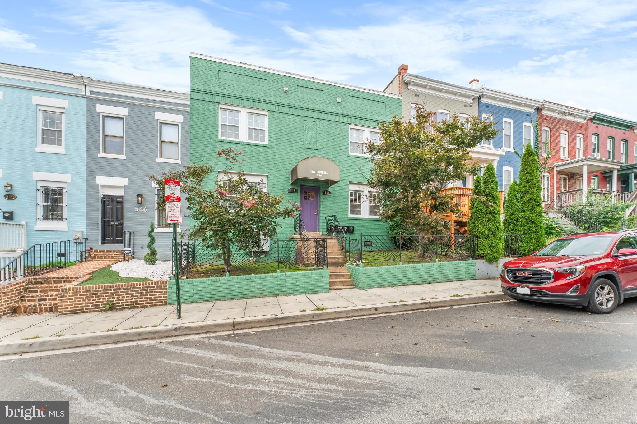 550 Hobart Place Northwest, Unit 1 Washington, DC 20001 - Photo 2 of 22 a front view of a house with a yard