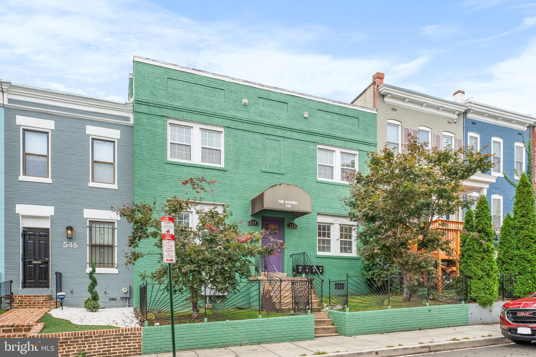 550 Hobart Place Northwest, Unit 1 Washington, DC 20001 - Photo 22 of 22 a front view of a house with garden