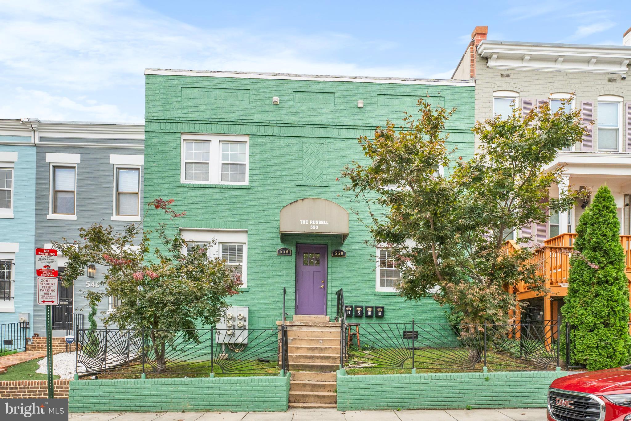 550 Hobart Place Northwest, Unit 1 Washington, DC 20001 - Photo 3 of 22 a front view of a house with garden