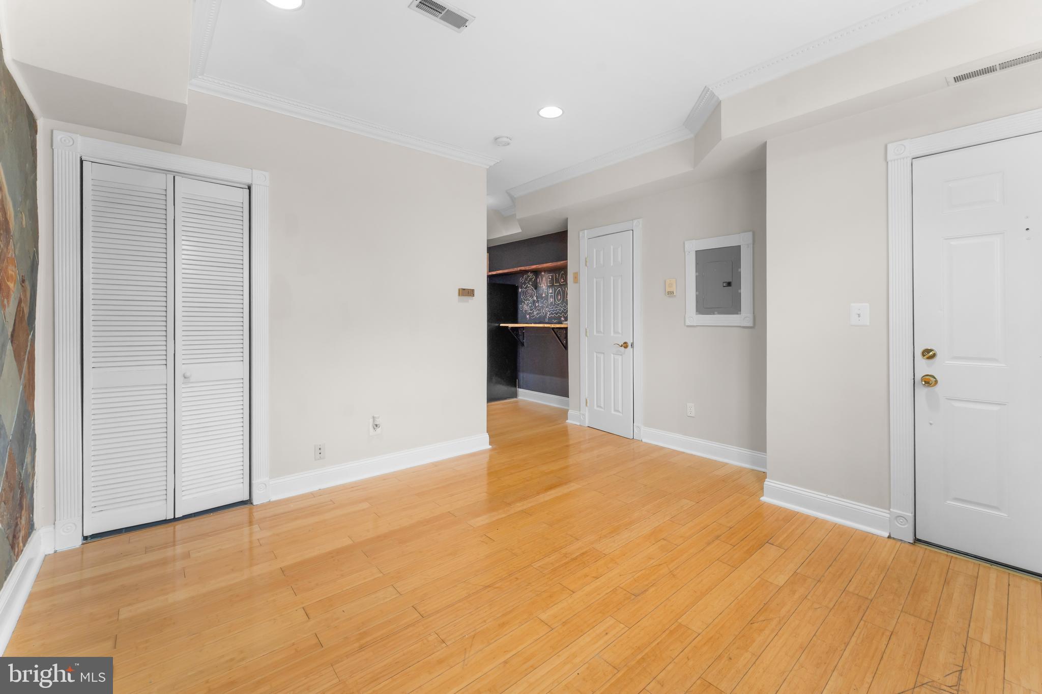 550 Hobart Place Northwest, Unit 1 Washington, DC 20001 - Photo 6 of 22 a view of an empty room with wooden floor