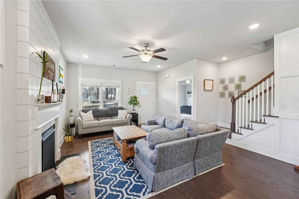 5175 North Pratt Street Covington, GA 30014 - Photo 12 of 52 a living room with furniture and a chandelier