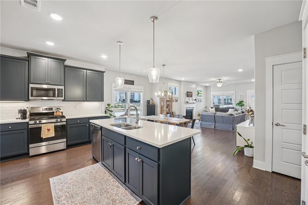 5175 North Pratt Street Covington, GA 30014 - Photo 23 of 52 a kitchen with sink stove and refrigerator