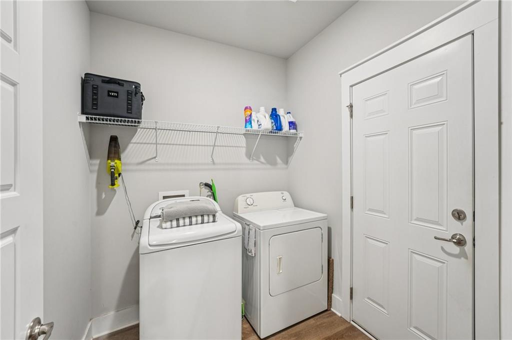 5175 North Pratt Street Covington, GA 30014 - Photo 26 of 52 a utility room with dryer and washer