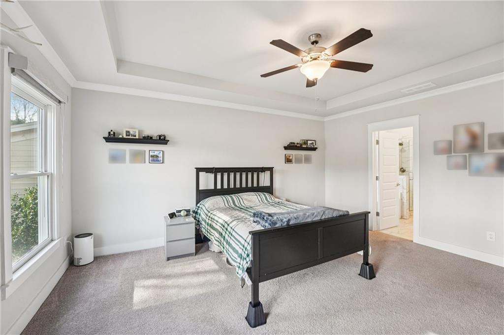 5175 North Pratt Street Covington, GA 30014 - Photo 30 of 52 a bed room with a bed and window