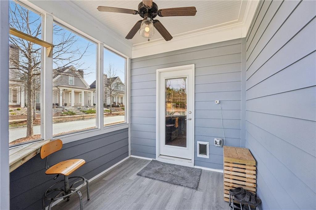 5175 North Pratt Street Covington, GA 30014 - Photo 44 of 52 a bedroom with a bed and a chandelier