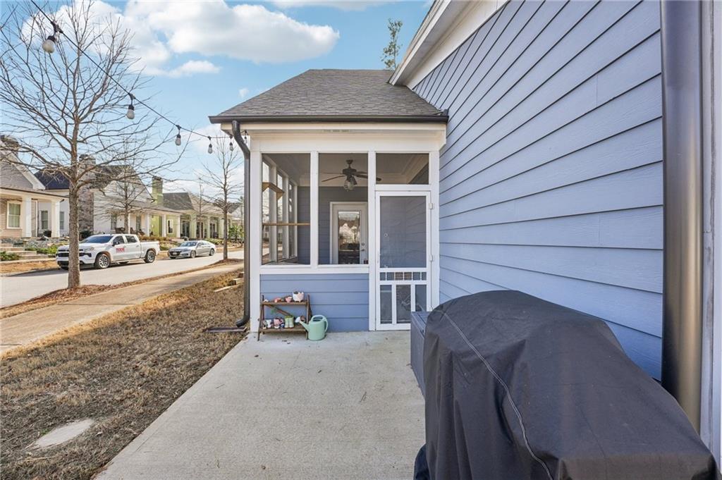 5175 North Pratt Street Covington, GA 30014 - Photo 49 of 52 a view of a patio with table and chairs and wooden fence