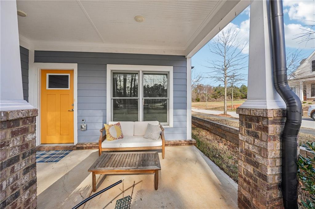 5175 North Pratt Street Covington, GA 30014 - Photo 5 of 52 a living room with furniture and a large window