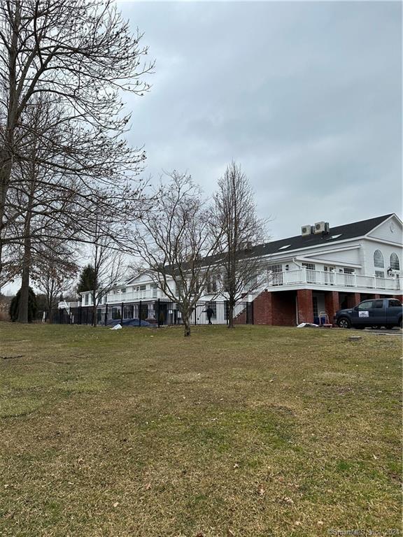 3 Banner Road, Unit 101 East Haddam, CT 06469 - Photo 19 of 19 a view of a house with a yard
