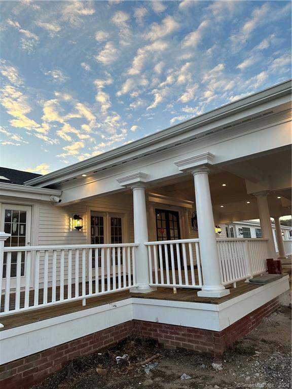 3 Banner Road, Unit 101 East Haddam, CT 06469 - Photo 7 of 19 a porch with a yard