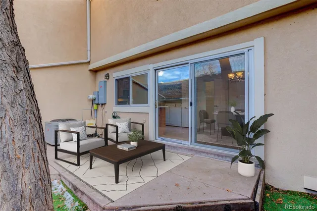 a view of a chairs and table in the patio