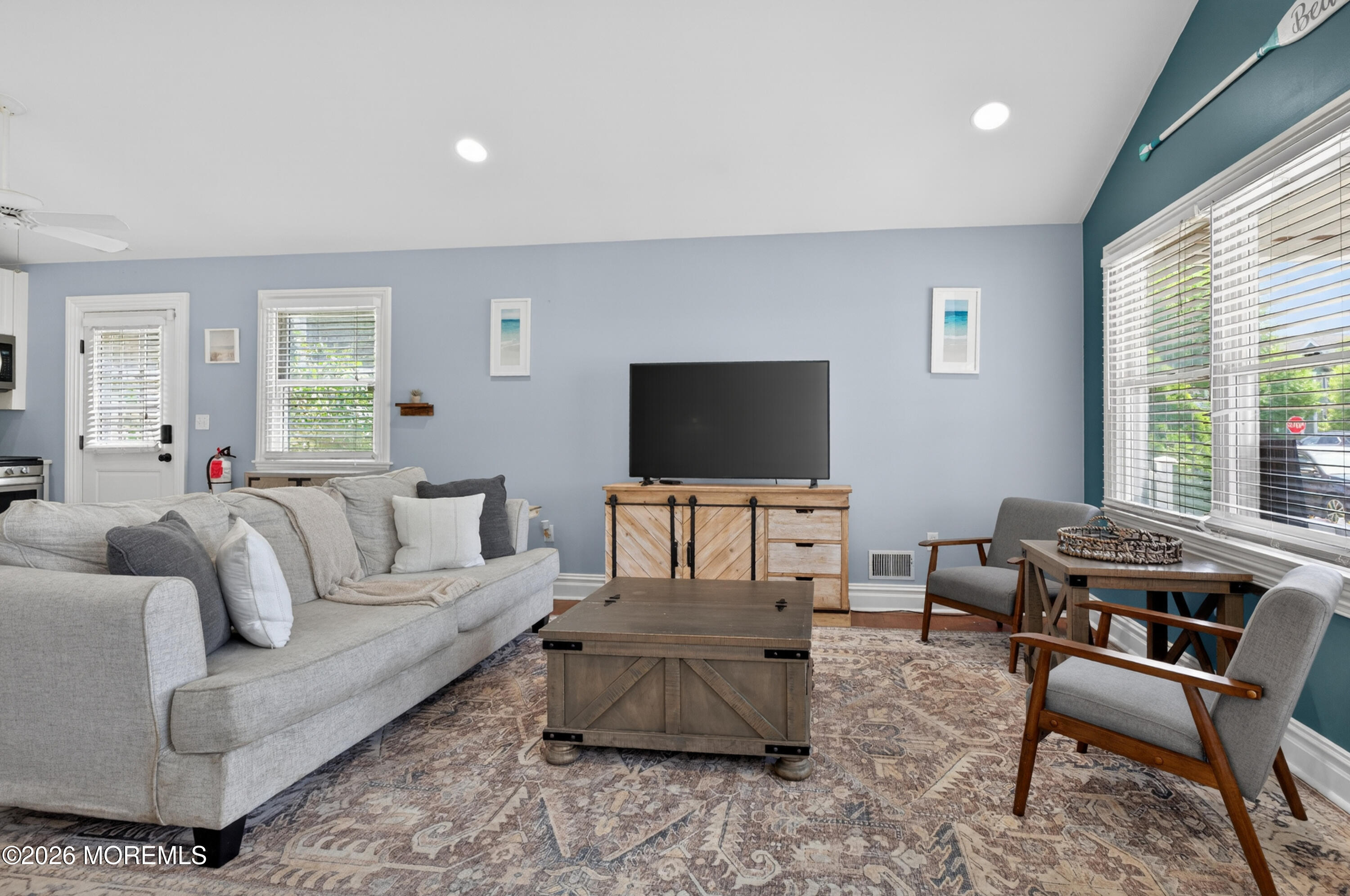 65 Heck Avenue Ocean Grove, NJ 07756 - Photo 8 of 37 a living room with furniture and a flat screen tv
