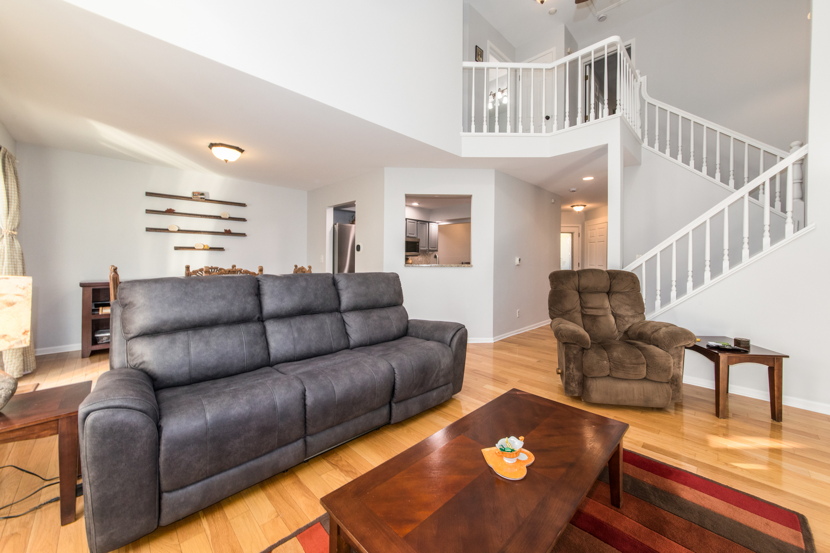 1068 Mattande Lane Naperville, IL 60540 - Photo 12 of 37 a living room with furniture and a rug