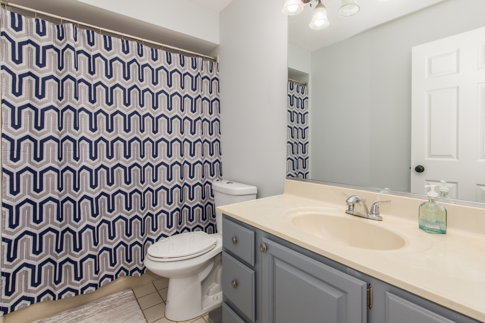1068 Mattande Lane Naperville, IL 60540 - Photo 18 of 37 a bathroom with a sink and a mirror