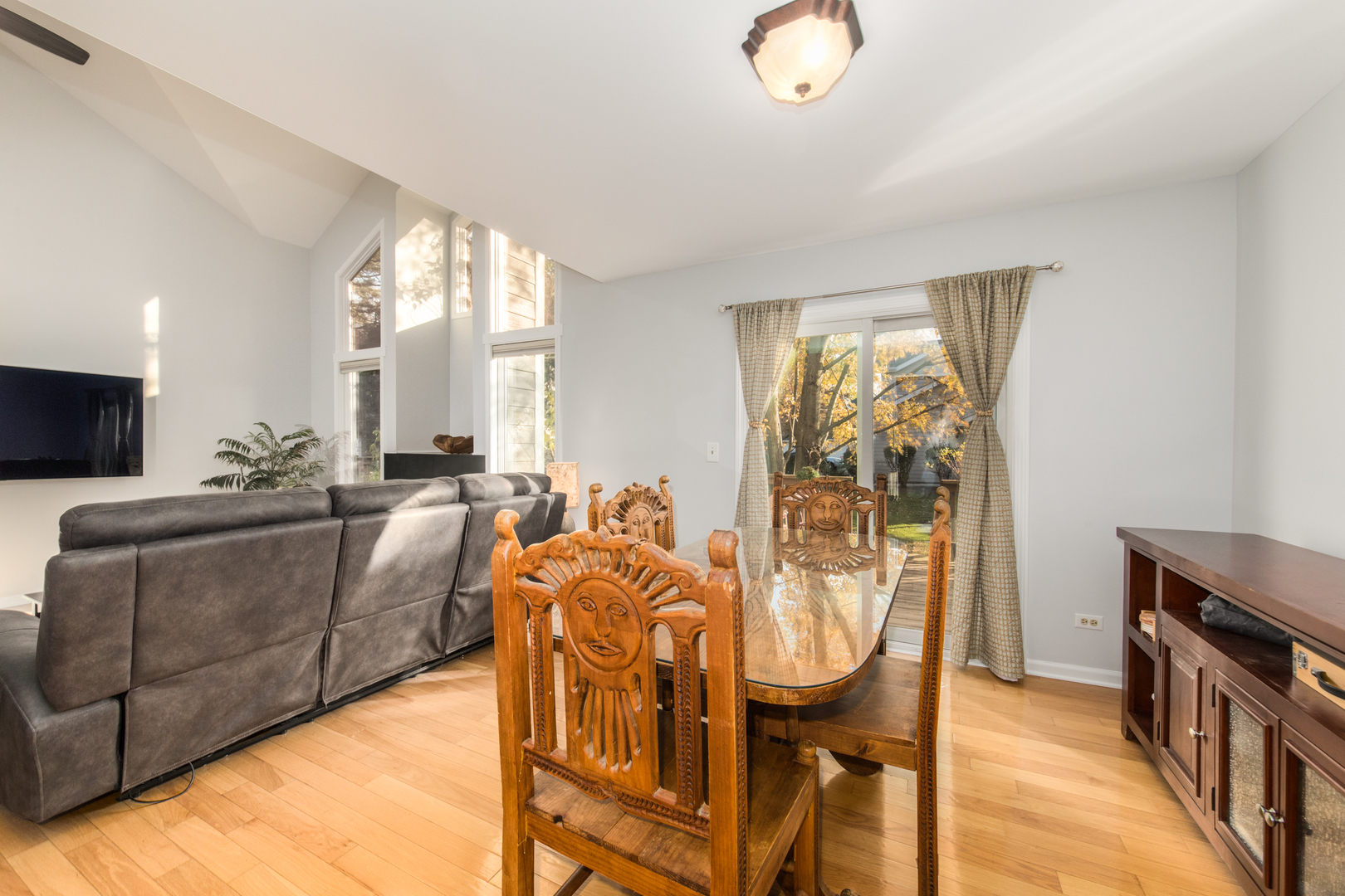 1068 Mattande Lane Naperville, IL 60540 - Photo 10 of 37 a living room with furniture a flat screen tv and a large window