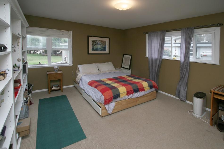 150 Toro Canyon Road Carpinteria, CA 93013 - Photo 8 of 10 a bedroom with a bed a dresser next to a window