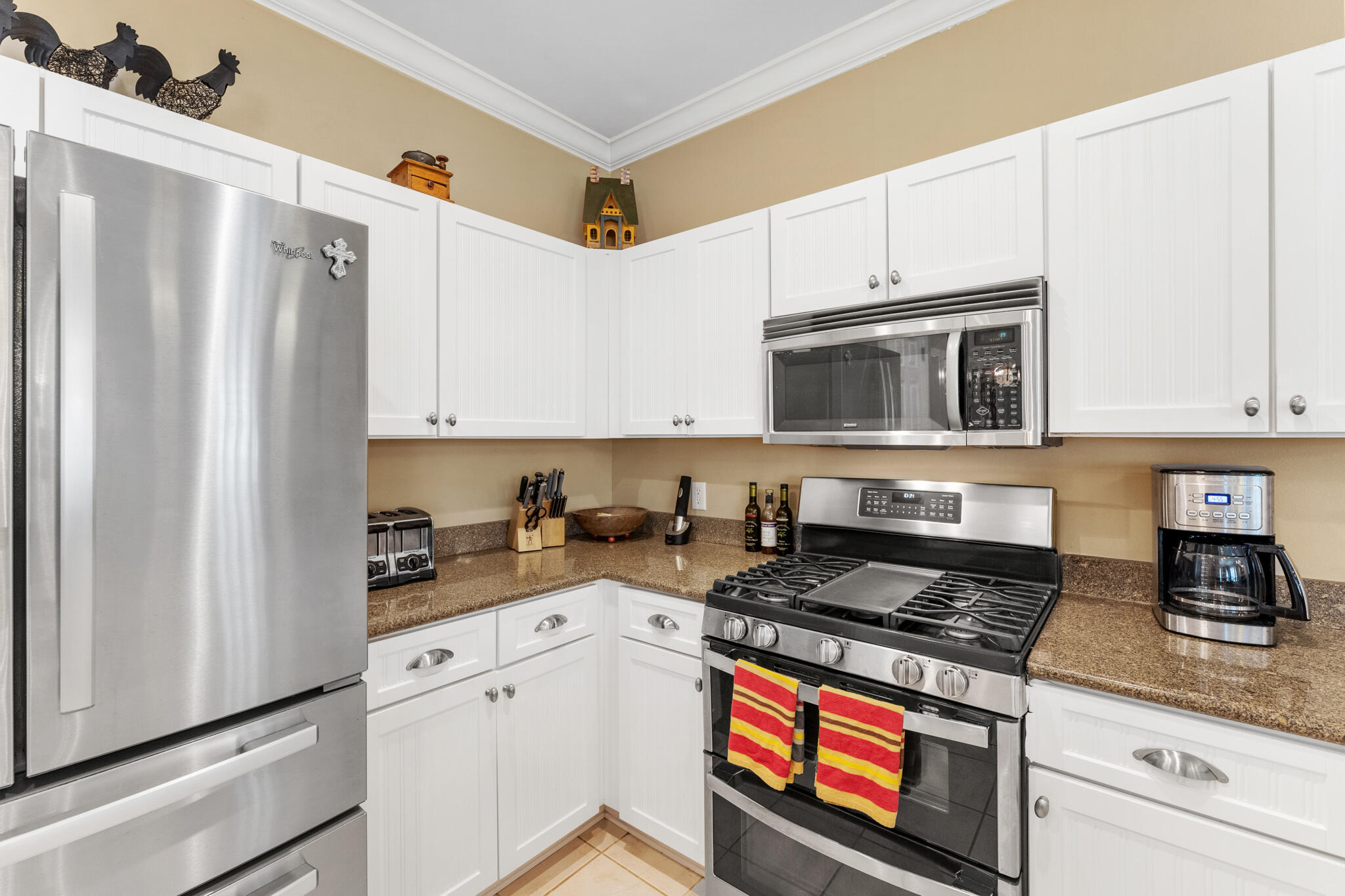 64 Spotted Dolphin Road Santa Rosa Beach, FL 32459 - Photo 15 of 43 a kitchen with stainless steel appliances a stove a microwave and cabinets