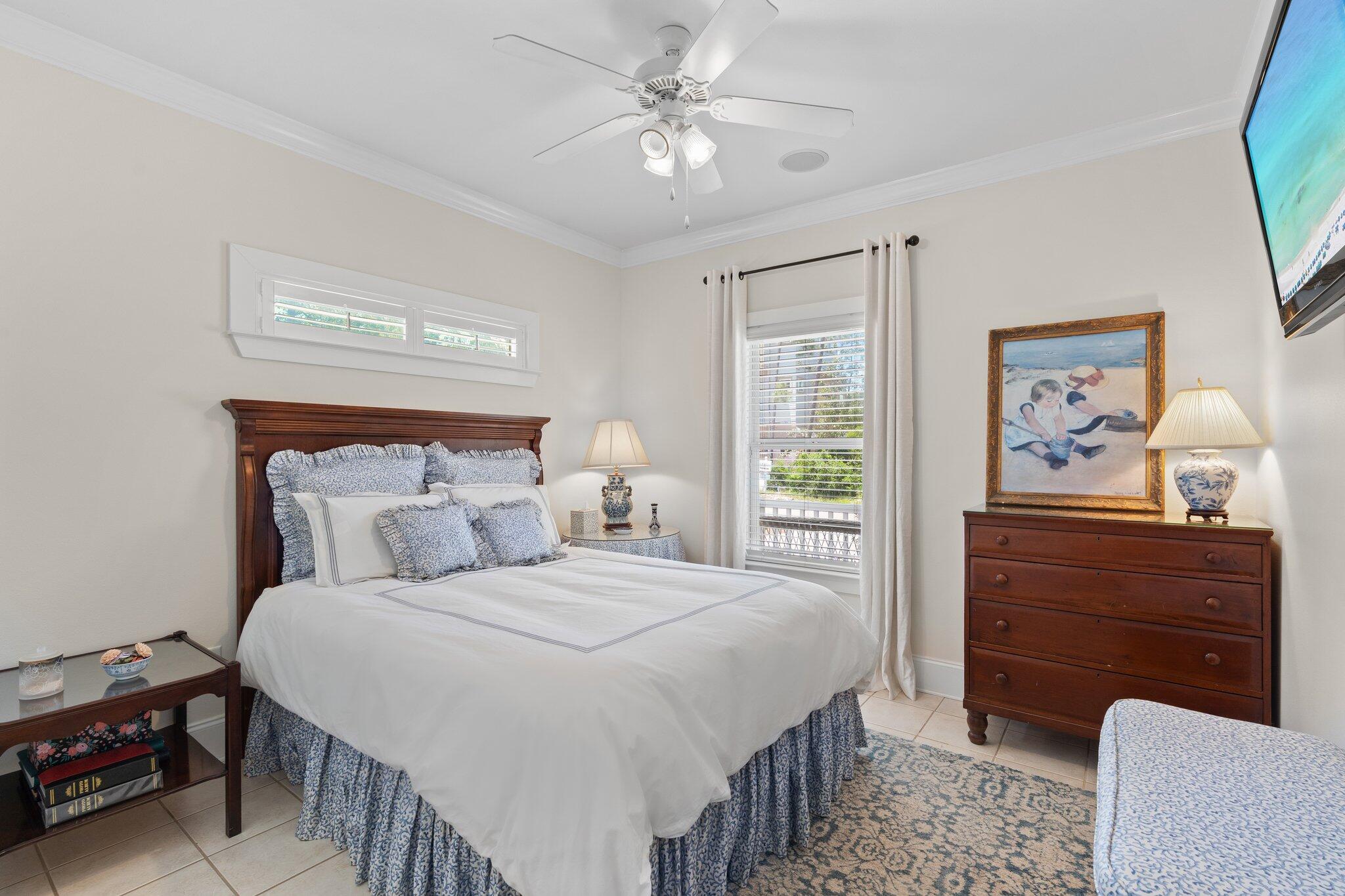 64 Spotted Dolphin Road Santa Rosa Beach, FL 32459 - Photo 16 of 43 a bedroom with a bed and a chandelier