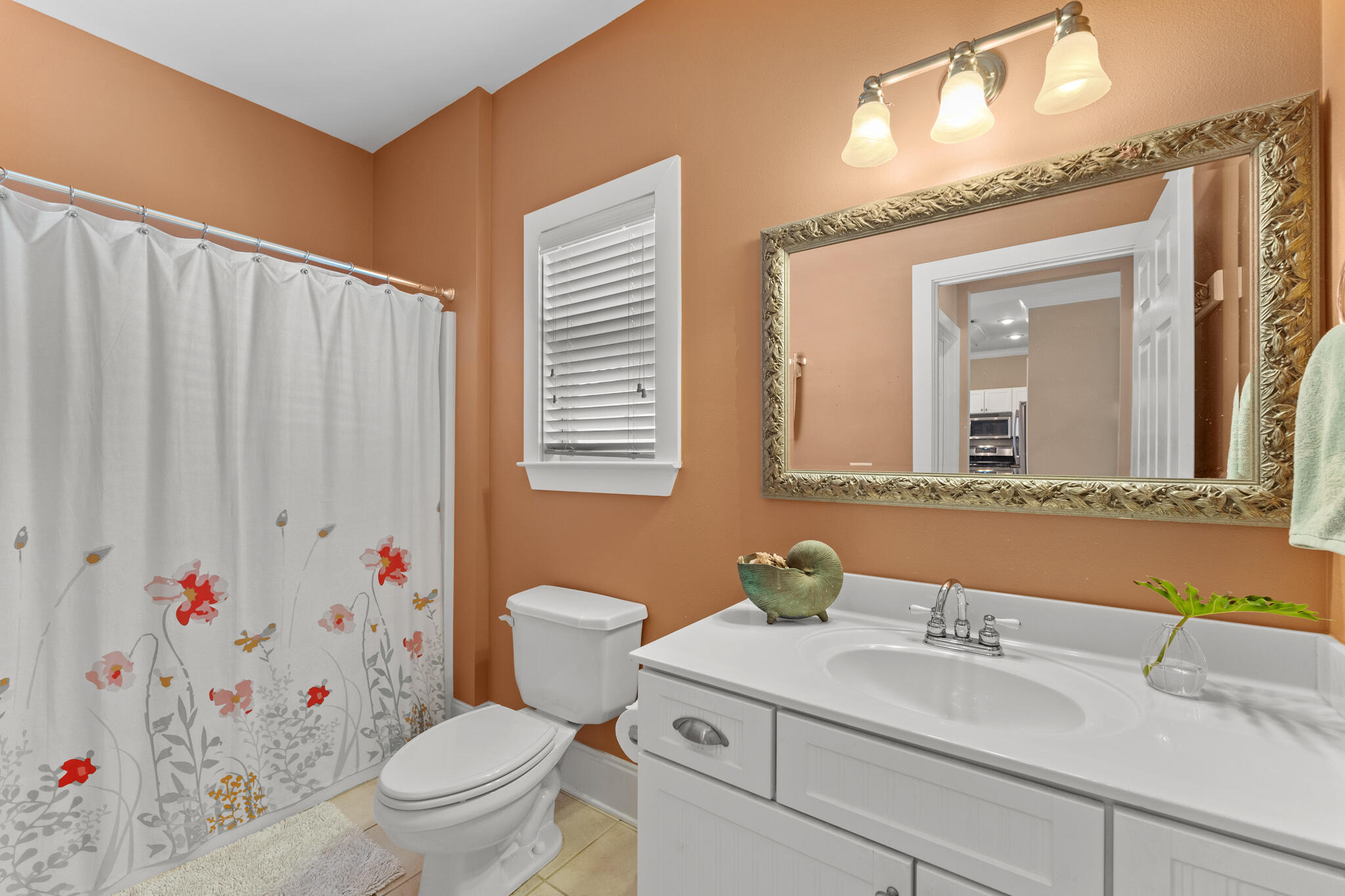 64 Spotted Dolphin Road Santa Rosa Beach, FL 32459 - Photo 17 of 43 a bathroom with a sink a toilet and a mirror