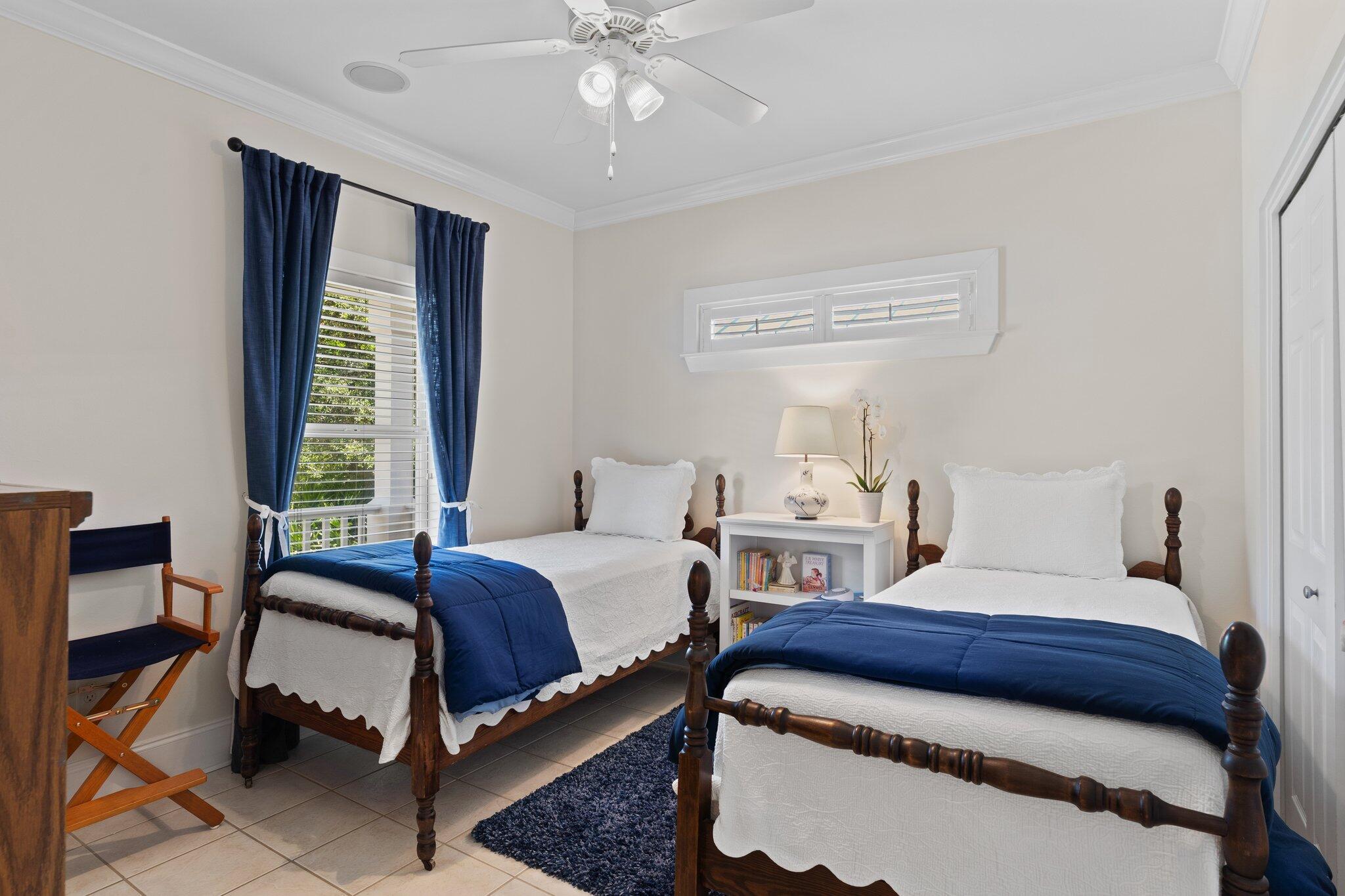 64 Spotted Dolphin Road Santa Rosa Beach, FL 32459 - Photo 18 of 43 a bedroom with two beds and a chandelier