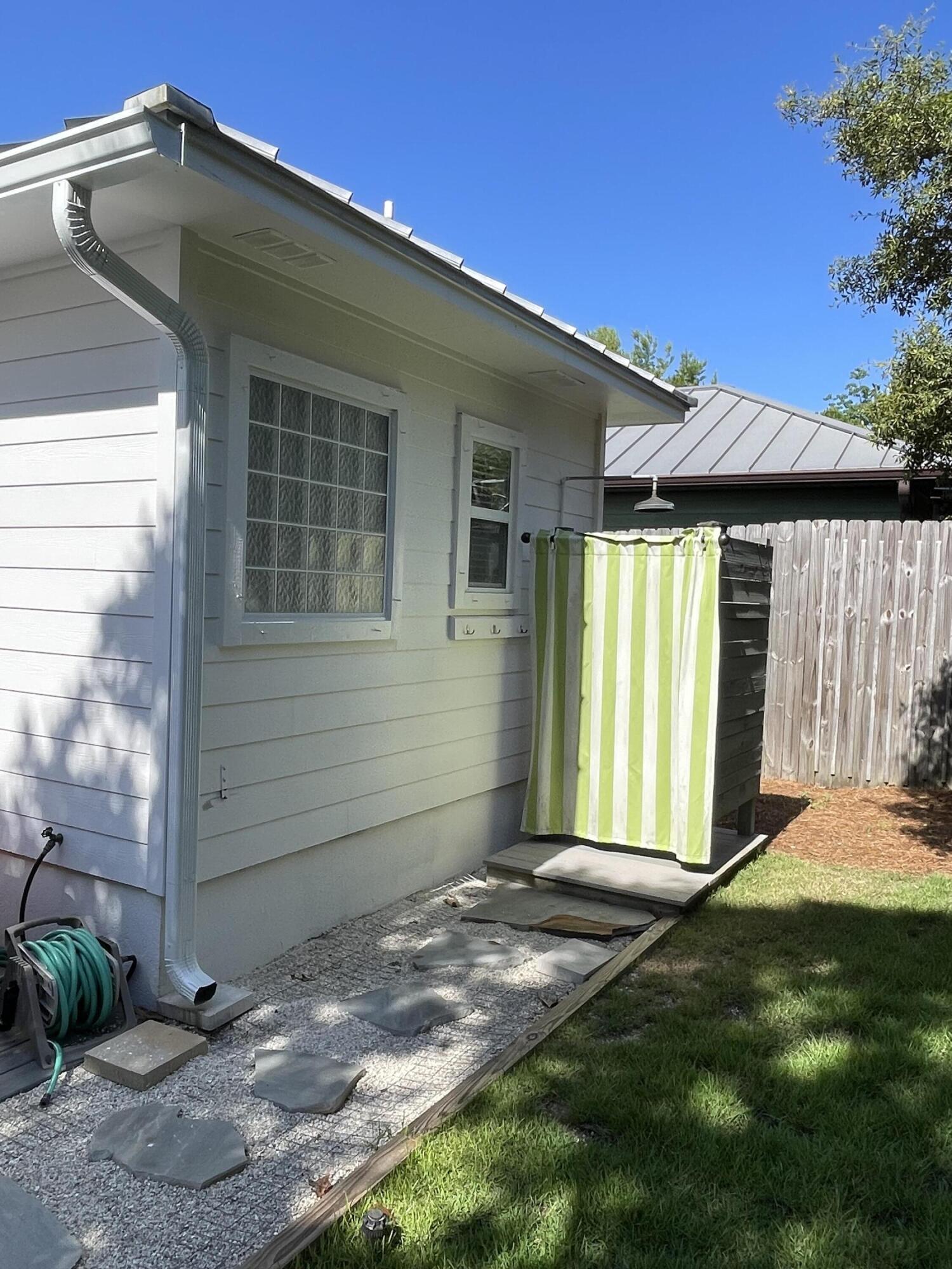 64 Spotted Dolphin Road Santa Rosa Beach, FL 32459 - Photo 29 of 43 a front view of a house with a yard